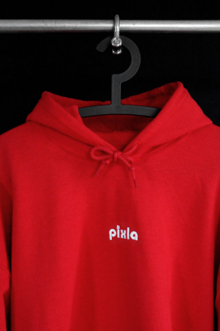 Cozy unisex go-to hoodie in red to curl up in. Soft, middle to heavyweight fabric with a super soft fleece inside. Embroidery on the front chest.