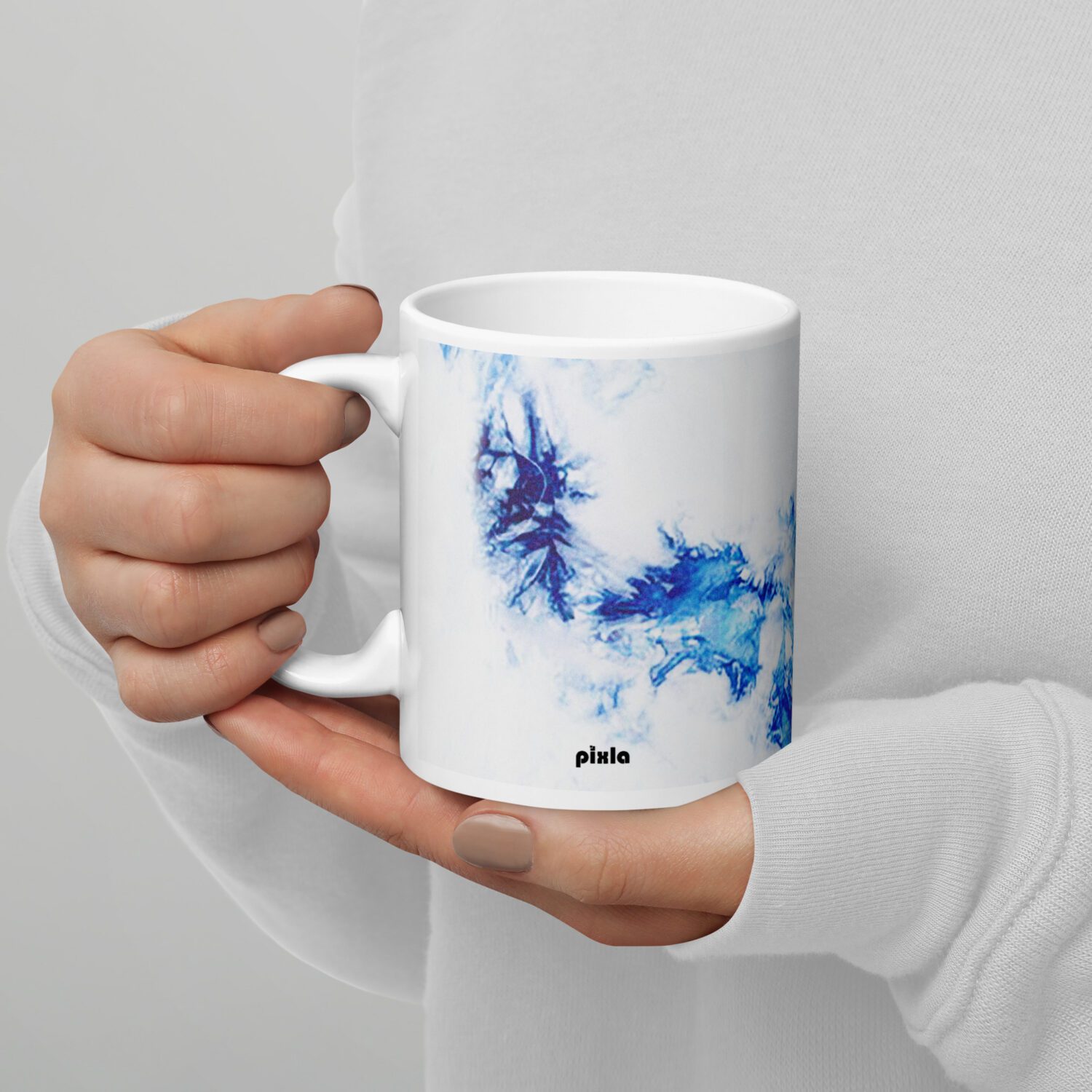 The perfect white and glossy white and blue tie dye mug that’s sturdy and comfortable with a vivid print that’ll withstand the microwave and dishwasher.
