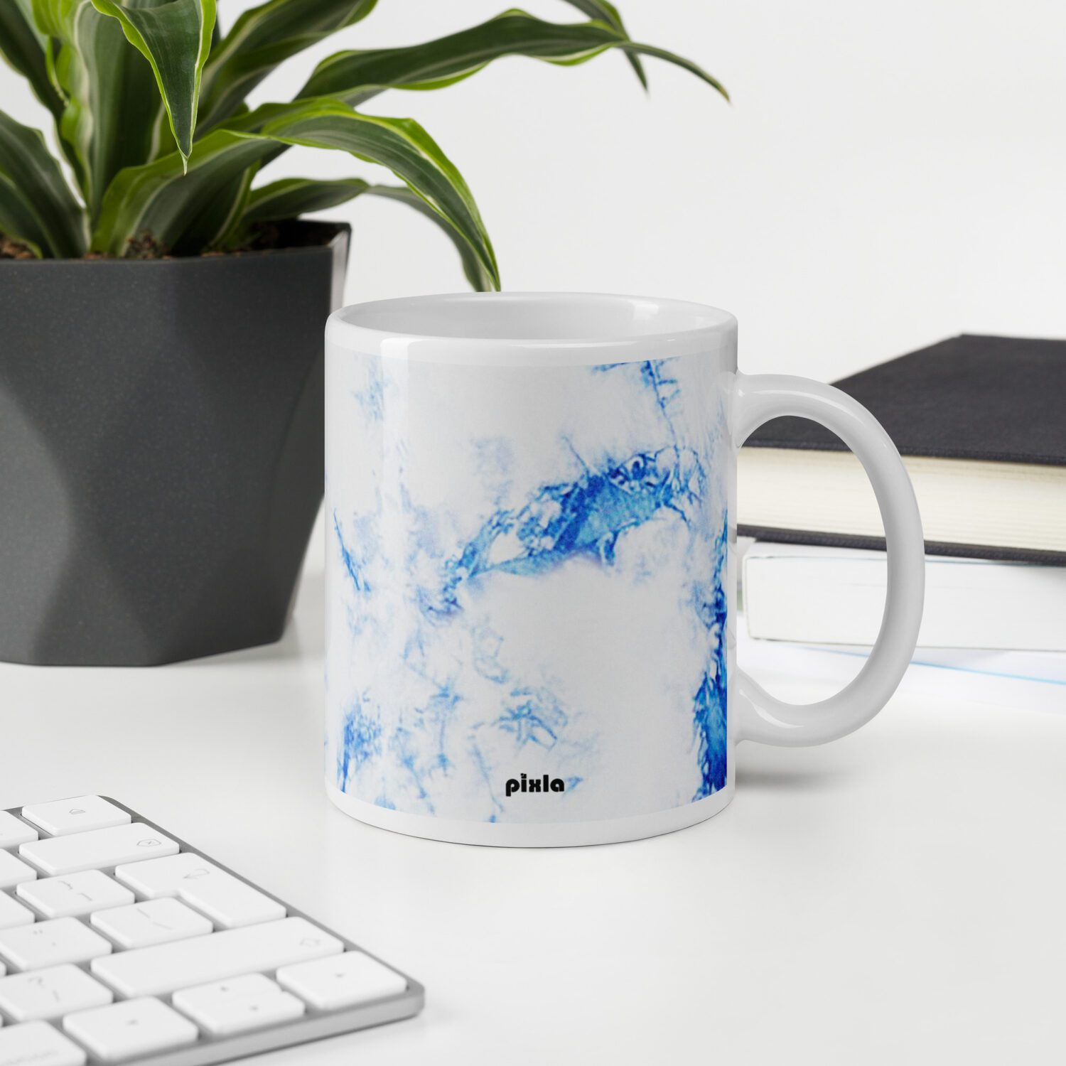 The perfect white and glossy white and blue tie dye mug that’s sturdy and comfortable with a vivid print that’ll withstand the microwave and dishwasher.